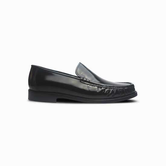 Black loafer shoe on a white background